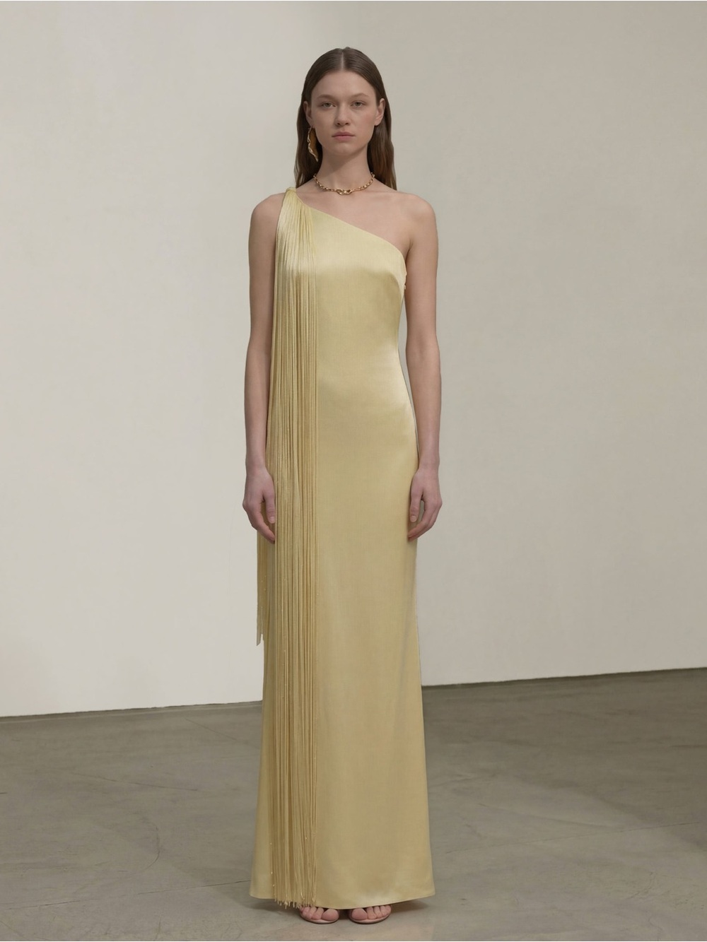 JW PEI One-Shoulder Fringe Satin Gown in Pale Yellow